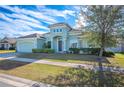 Two-story house with a large front yard, and neutral color scheme at 1836 James Towne Ln, Bartow, FL 33830