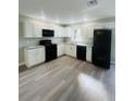 Modern kitchen featuring white cabinets and granite countertops at 2006 Kendrick Ln, Lakeland, FL 33805