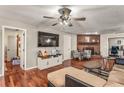 Spacious living room featuring a brick fireplace and hardwood floors at 2070 Katie Ct, Winter Haven, FL 33884