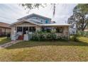 Two-story house with stone facade and landscaped yard at 306 Avenue C Ne, Winter Haven, FL 33881