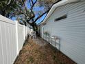 A quiet, fenced backyard offers a private outdoor space for relaxing and entertaining at 308 Kerneywood St, Lakeland, FL 33803