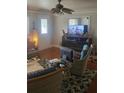 Bright living room with comfy wicker furniture and a large window at 308 Kerneywood St, Lakeland, FL 33803