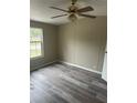 Spacious bedroom with new laminate flooring and ceiling fan at 3472 Avenue V Nw, Winter Haven, FL 33881