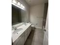 Clean bathroom with double vanity, bathtub and tile flooring at 357 Siesta Vista Ct, Davenport, FL 33896