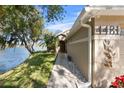 Front walkway to house, beside a lake at 4481 Pebble Pointe Dr, Lakeland, FL 33813