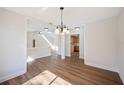 Spacious dining area with hardwood floors and chandelier at 4718 Valley Hill Ct, Lakeland, FL 33813