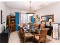 Elegant dining room featuring a glass table and six chairs at 518 Grand Reserve Dr, Davenport, FL 33837