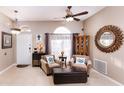 Cozy living room with two armchairs and ottoman at 518 Grand Reserve Dr, Davenport, FL 33837