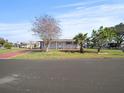 Charming single-story home featuring a well-maintained lawn and mature landscaping for curb appeal at 6087 Southern Oaks Se Dr, Winter Haven, FL 33884