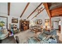 Spacious living room featuring high ceilings, exposed beams, and a lofted area at 1005 Shadow Run Dr, Lakeland, FL 33813