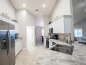 Modern kitchen with stainless steel appliances and granite countertops at 10763 Sw 76Th Ct, Ocala, FL 34480