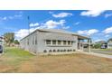 Gray manufactured home with well-maintained lawn at 1610 Reynolds Rd # 236, Lakeland, FL 33801