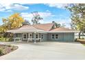 Attractive single-story home with a large front yard, inviting entryway, and neutral exterior colors at 20 N Lake Idylwild Dr, Winter Haven, FL 33881