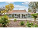 Charming single-story home with a welcoming front porch and beautifully landscaped front yard at 20 N Lake Idylwild Dr, Winter Haven, FL 33881