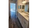 Modern bathroom with double vanity and updated fixtures at 2021 Alderman Rd, Auburndale, FL 33823