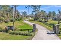 Long driveway leads to home through gates at 2455 Gerber Dairy Rd, Winter Haven, FL 33880