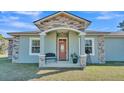 House exterior with stone accents and covered porch at 2455 Gerber Dairy Rd, Winter Haven, FL 33880