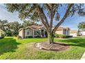 Exterior view of a house nestled amongst mature trees at 3116 Hawks Ridge Dr, Lakeland, FL 33810