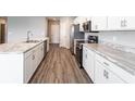 Modern kitchen with stainless steel appliances and marble countertops at 3142 Laurel Oak Ln, Winter Haven, FL 33884