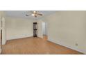 Living room with wood flooring, ceiling fan and neutral walls at 470 Lucille St, Bartow, FL 33830