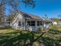 House exterior showcasing a screened porch at 702 Nw 1St Ave, Mulberry, FL 33860