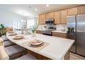 Modern kitchen with large island, stainless steel appliances, and white countertops at 7602 Sw 107Th Ln, Ocala, FL 34480