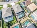 Community overview showcasing multiple houses with pools at 1074 Berkeley Dr, Kissimmee, FL 34744