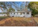 View of the home's backyard with some trees and grassy area at 4380 Turner Rd, Mulberry, FL 33860