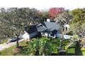 Single-Gathering home nestled among lush trees and landscaping at 4419 Burlington Dr, Winter Haven, FL 33880