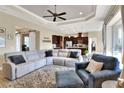 Open floor plan living room with sectional sofa and view of kitchen at 4434 Micanope Crescent Dr, Lakeland, FL 33811