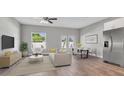 Open living room and kitchen with hardwood floors at 460 N 1St Ave, Bartow, FL 33830
