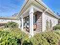 Charming front porch with a swing and lush landscaping at 6127 Magpie Dr, Lakeland, FL 33809