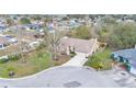 Expansive aerial view showcases the home's location in a peaceful residential neighborhood with mature trees at 6244 Napa Dr, Lakeland, FL 33813