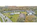 Aerial of condo community with pool and surrounding landscape at 1600 W Lake Parker Dr # B9, Lakeland, FL 33805