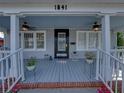 Inviting front porch with ceiling fans, white railings, and space for seating arrangements at 1841 Casco St, Lakeland, FL 33801