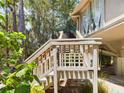 Wooden staircase leading to elevated home's deck at 2907 Marion Way # 2907, Haines City, FL 33844
