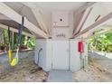 Exterior laundry room with access from underneath the home at 2907 Marion Way # 2907, Haines City, FL 33844