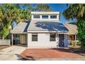 Charming single-Gathering home featuring a metal roof and mature trees at 3544 Raintree Cir, Lakeland, FL 33803