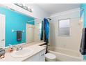 Functional bathroom with a tub and shower combination at 403 Saint Anns Dr, Winter Haven, FL 33884