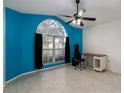 Bright living room featuring a large window and neutral color palette at 403 Saint Anns Dr, Winter Haven, FL 33884