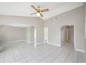 Open living room featuring tile flooring, neutral paint and high ceilings at 519 Eagle Ct, Kissimmee, FL 34759