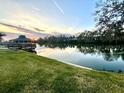 Beautiful waterfront sunset view showcasing a tranquil lake and lakeside gazebo at 600 Caribbean Dr, Lakeland, FL 33803