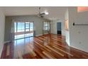 Bright, open living space featuring vaulted ceilings, fan, and hardwood floors at 600 Caribbean Dr, Lakeland, FL 33803