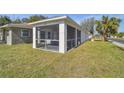 Enjoy the outdoors in this spacious screened porch at 629 7Th W St, Lakeland, FL 33805