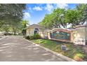 Elegant entrance to Lake Marion Resort, featuring lush landscaping and a welcoming sign at 116 Ocean Bluff Dr # 116, Kissimmee, FL 34759