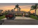 Charming single-story home boasting a well-manicured lawn and palm trees in the front yard at 116 Ocean Bluff Dr # 116, Kissimmee, FL 34759