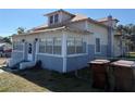 Classic home showing windows, siding and entry to sunroom with metal roof at 118 S 5Th St, Haines City, FL 33844