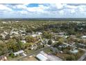 Aerial view of a neighborhood showcasing a tree-lined street and community at 1290 S Mcadoo Ave, Bartow, FL 33830