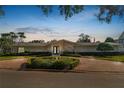 Charming exterior featuring a well-manicured lawn and beautiful landscaping at 1401 Easton Dr, Lakeland, FL 33803