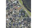 Aerial view showing the neighborhood with its street layout and lake, in a residential area at 2015 E Beacon By Way, Lakeland, FL 33803